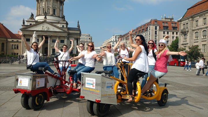 Happy customers from Germany on two of our FunBikes / Teambikes / ConferenceBikes in the center of Berlin at Gendarmenmarkt.