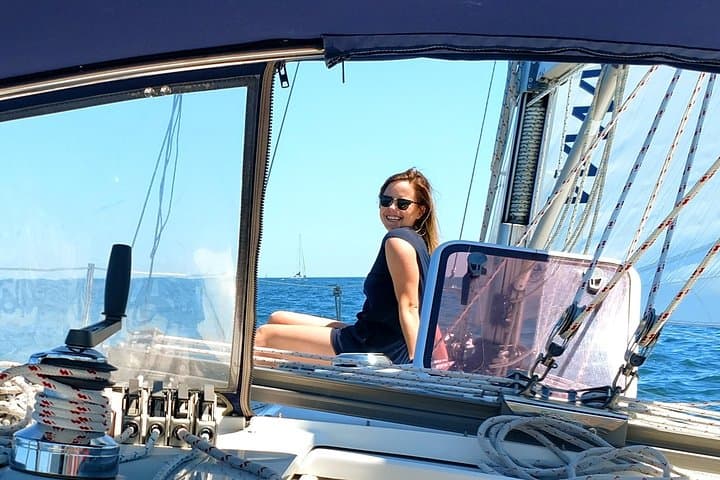 Sitting on the foredeck taking in a relaxing sail.