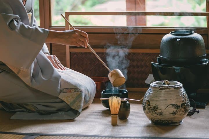 Steam clouds up as hot water is poured into the tea bowl during the tea ceremony.