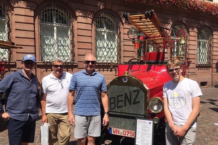 Posing with a vintage Mercedes Benz firetruck.